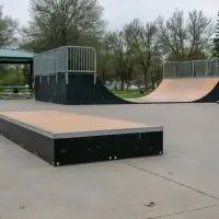 Box with mini ramp and high rail in background