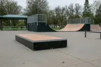 Box with mini ramp and high rail in background